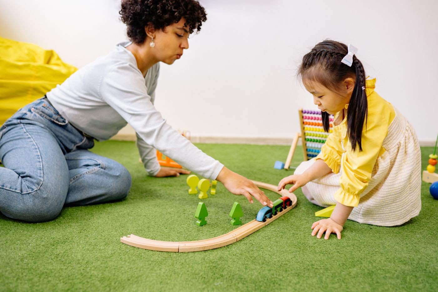 Practitioner working one-to-one with a young pupil